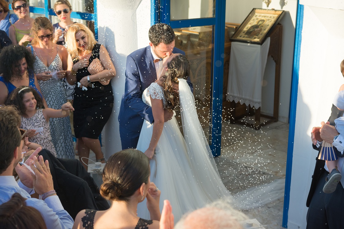 skyros sporades greece summer maid of honors happy rice kiss bride wedding dress weddingskyros wedding groom flowers bridal bouquette orthodox church